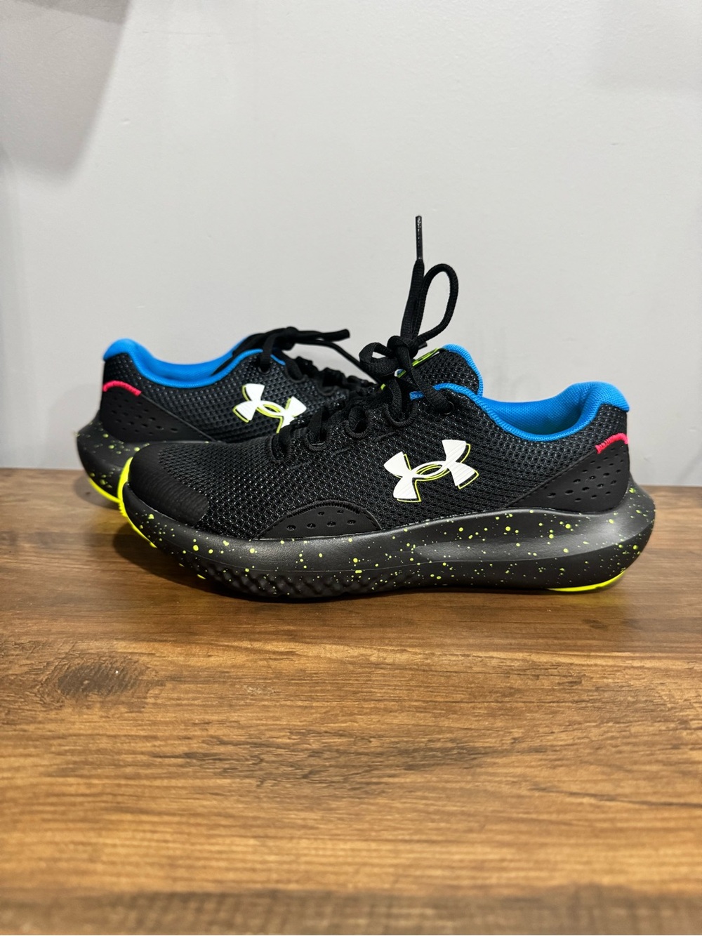Under Armour Kids' Black Sneakers with Blue Lining and Neon Yellow Accents
